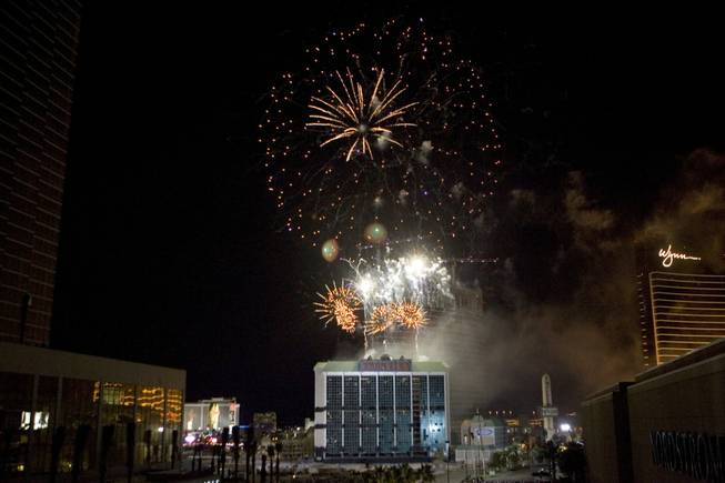 A fireworks show explodes over the New Frontier hotel tower before it is imploded in Las Vegas, Nevada November 13, 2007. The casino on The Las Vegas Strip was purchased by Elad properties, an Israeli-owned real estate investment group, for more than U.S. $1.2 billion in May 2007. Elad Group, which also owns the Plaza hotel in New York, and the IDB Group are expected to build a multi-billion dollar Plaza-themed megaresort themed on the site. 